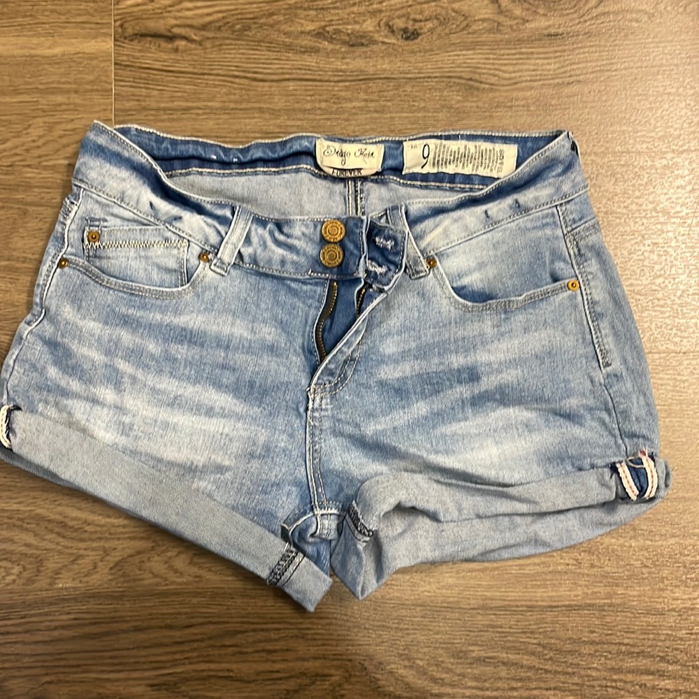 Light denim mid rise shorts